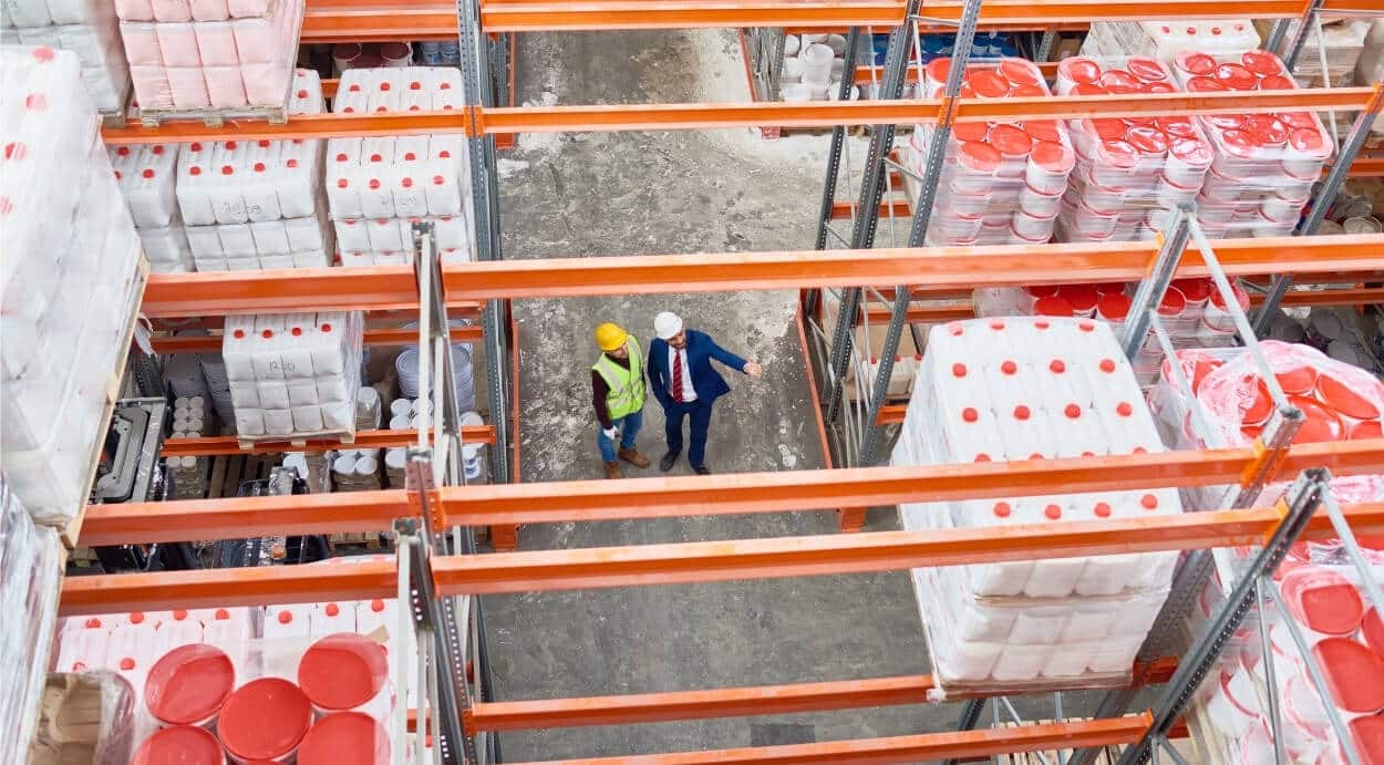 Warehouse operators calculating inventory