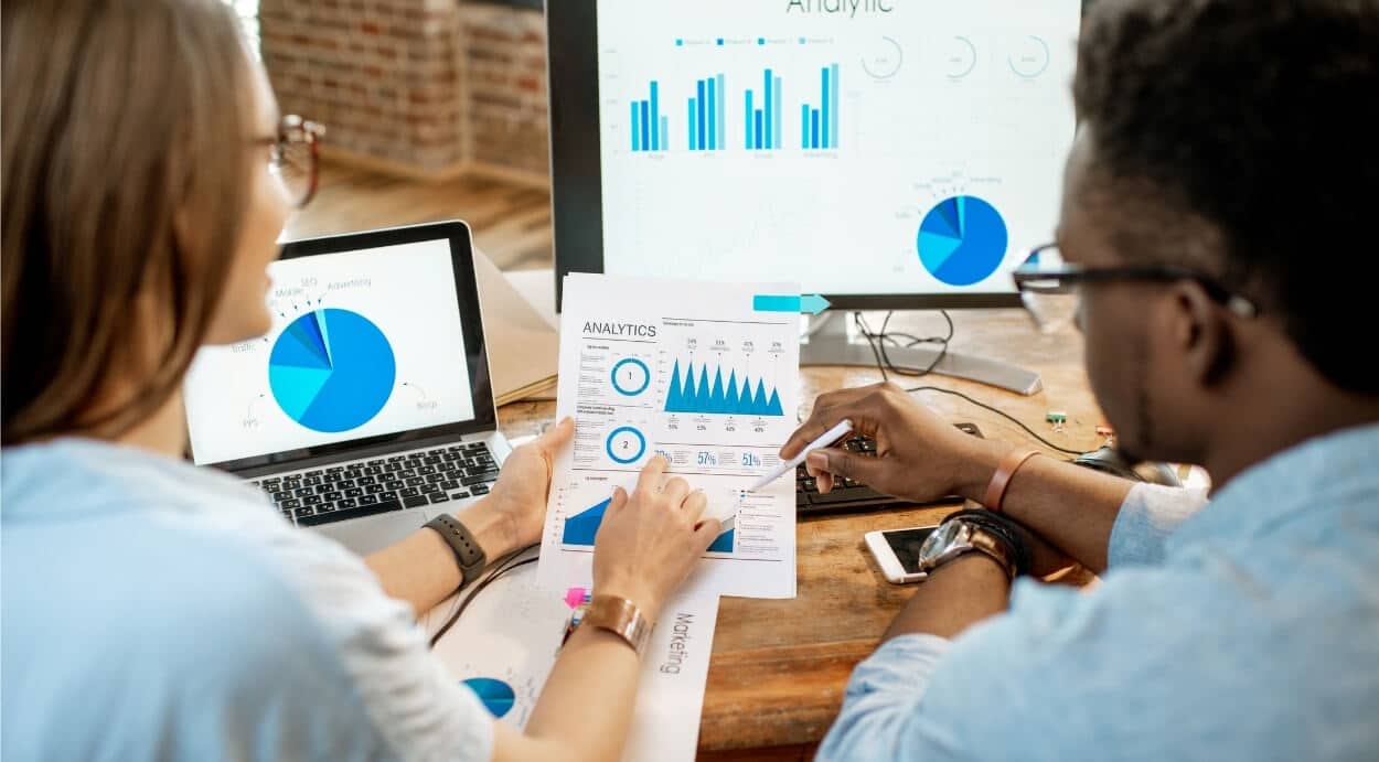 Analysts reviewing charts and retrieving KPIs