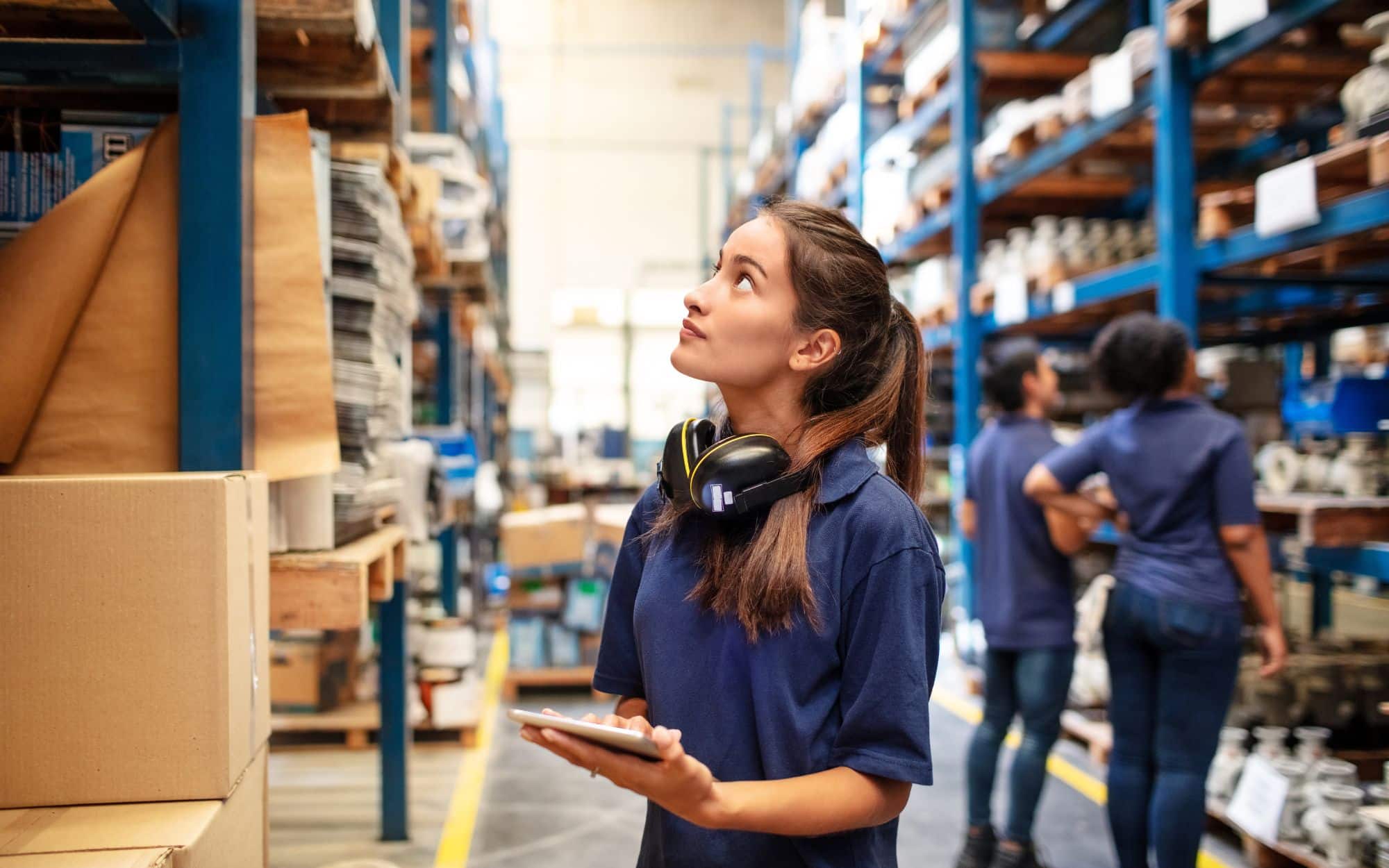 Warehouse worker inspecting inventory levels