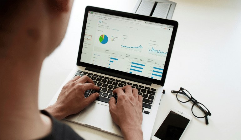 Men looking data on a laptop