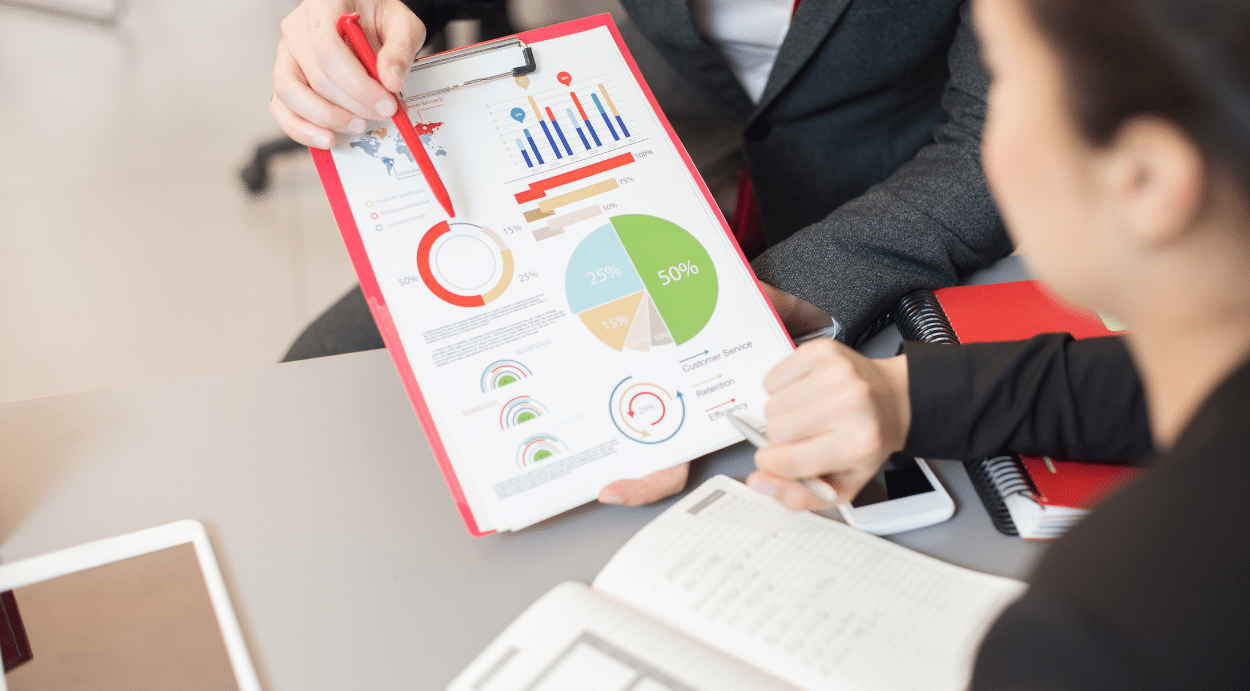 2 Accountants analyzing a financial statement.
